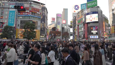 Busy-day-in-Tokyo-Japan-at-the-Famous-Shibuya-Crossing-on-the-street,-many-people