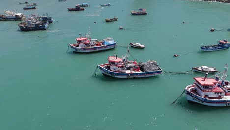 Aerial-Flying-Over-Moored-Fishing-Boats-In-Port-Of-San-Antonio-In-Chile