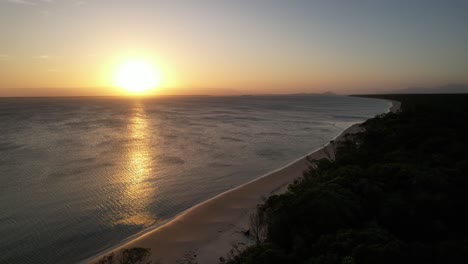 Panoramic-aerial-image-of-beaches-and-forest,-sunligth,-Ilha-do-Mel,-Paraná,-Brazil