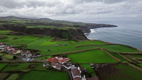 Aerial-view-of-an-Azores-Island-Sao-Miguel,-view-of-the-mountains-at-the-atlantic-ocean-with-green-fields