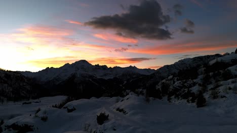 Majestic-sunset-over-the-Dolomites-snowy-mountains-of-Valmalenco-in-Valtellina-in-winter-season,-Italy