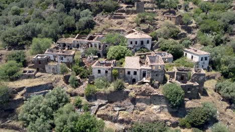 Tilted-Aerial-View-over-Abandonated-Traditional-Rural-Village-of-Karavas-in-Kythira-Island,-Greece