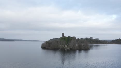 Aerial-drone-approach-of-the-ivy-clad-McDermott-Castle-ruins-on-an-island-in-Lough-Key,-County-Roscommon