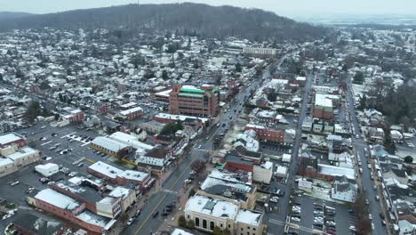 Aerial-establishing-shot-of-American-suburb-covered-in-snow