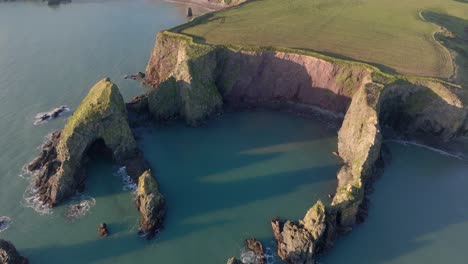 Drone-panorama-hidden-beach-sea-stacks-sea-caves-and-still-seas-Copper-Coast-Waterford-Ireland