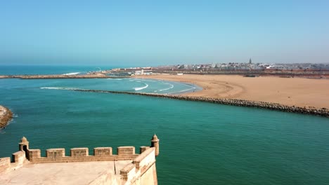 Stunning-panoramic-view-from-Oudayas-lookout-to-Sale-Medina-and-the-local-sandy-beaches-in-Rabat,-Morocco