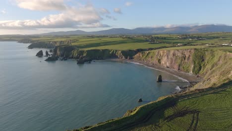 Drone-Waterford-Ireland-panorama-Ballydwane-Beach-copper-Coast-with-the-majestic-Comeragh-mountains-backdrop