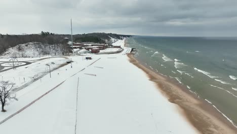 Coastal-track-with-drone-along-the-frozen-sand
