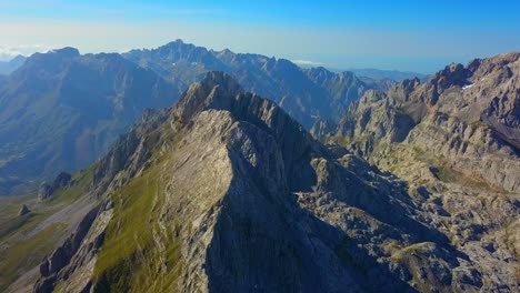Capturing-the-essence-of-Picos-de-Europa-from-a-unique-perspective,-the-drone-unveils-a-mesmerizing-ballet-of-untamed-nature,-showcasing-the-rugged-elegance-and-panoramic-drama-of-the-European-peaks