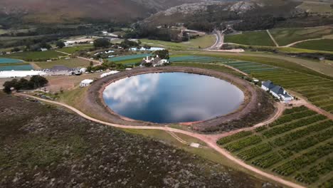 Perfectly-round,-man-made-dam-on-a-wine-farm-in-South-Africa