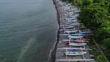 drone-flying-over-a-beach-revealing-how-many-fishing-boats-are-on-the-beach
