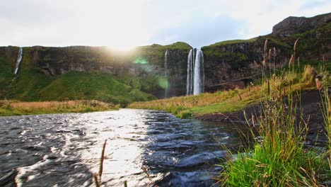 Low-view-shot-from-the-stream-of-Seljalandfoss-one-of-the-most-beautiful-waterfall-in-iceland-in-summer