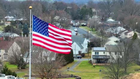 Aerial-establishing-shot-of-an-American-flag-waving