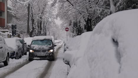 Car-Travel-On-Snowy-Residential-Street-On-Winter-Day