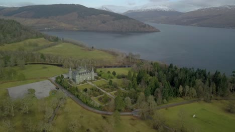 Aerial-establishing-shot-of-famous-Inveraray-Castle-at-Loch-Fyne-Lake-in-Scotland