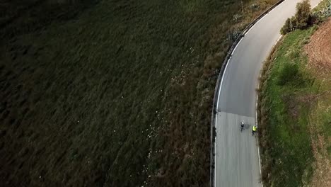 Two-men-riding-their-bicycles.-Drone-view