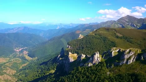Drone's-ascent-over-Picos:-Peaks-punctuate-the-skyline,-a-silent-symphony-of-altitude