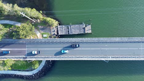 Drone-aerial-landscape-cars-driving-on-Toukley-bridge-travel-transport-infrastructure-Gorokan-boat-ramp-wharf-Central-Coast-Australia