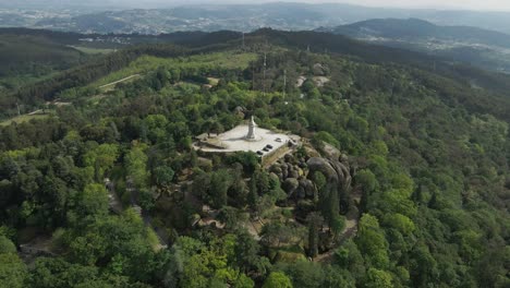 Pio-IX-Statue-at-Penha-Sanctuary,-Guimarães,-Portugal---aerial