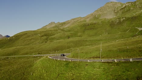 A-sports-car-driving-on-a-twisty-road-in-the-mountains
