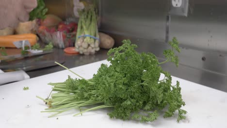 Up-close-shot-of-chef-hands-chopping-up-cilantro