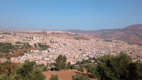Morocco,-Fes,-view-of-the-country's-cultural-capital-city-from-distance-during-daylight-with-clear-blue-sky