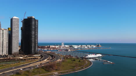Aerial-view-over-DuSable-Harbor,-toward-the-Navy-pier,-spring-day-in-Chicago,-USA