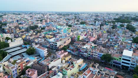 Densely-packed-colorful-buildings-in-the-Indian-ancient-city-of-Madurai-in-an-urban-area,-daytime,-aerial-view