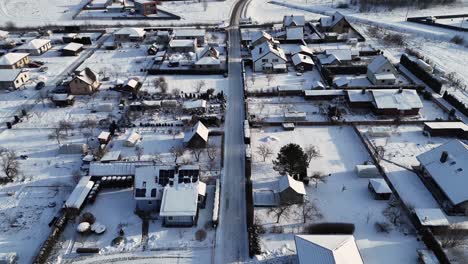 Aerial-view-of-residential-streets-covered-in-fresh-snow-during-the-winter
