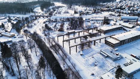 Aerial-view-of-vintage-train-loading-area-amidst-winter-landscape