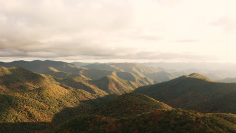 Drone-over-mountain-landscape-at-sunset-golden-hour---smokey-mountains,-blue-ridge,-Appalachian