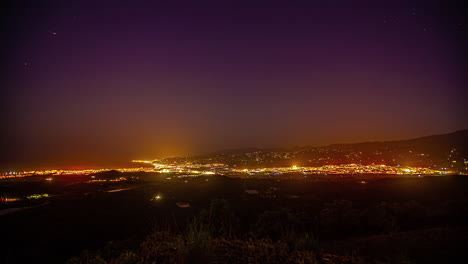 Night-to-day-transition-time-lapse-overlooking-beautiful-coast-town-Malaga-and-Mediterranean-sea