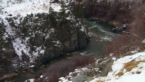 River-Streaming-Through-Winter-Landscape-In-Boise-National-Forest,-Idaho,-USA