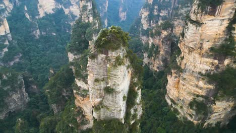 Aerial-orbiting-shot-of-a-rock-column-within-Zhangjiajie-National-Park