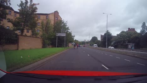 A-time-lapse-of-a-group-of-road-cyclists-cycling-on-a-busy-Glasgow-road
