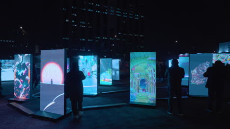 People-Watch-Digital-Art-Exhibition-on-LED-Screens-at-Hight-in-Gwanghwamun-Square,-Seoul-Center