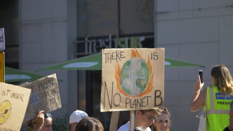 Fridays-for-Future-FFF-protest-with-activist-marching-and-holding-a-sign-saying-there-is-no-planet-B-in-Stuttgart,-Germany