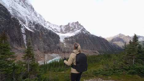 Woman-walking-away-from-Angel-Glacier-and-Mount-Edith-Cavell-viewpoint
