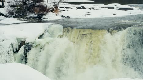 A-4K-panning-Shot-of-environment-nature-Tourism-Travel-Landmark-frozen-winter-Pisew-Kwasitchewan-Falls-Waterfall-Provincial-Park-near-Thompson-Manitoba-Northern-Arctic-Canada-Landscape
