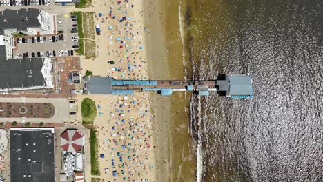 Overhead-view-of-the-Old-Orchard-Pier-in-Maine-with-crowded-beaches