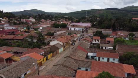 Aerial:-Clay-tile-rooftops-in-quaint-Bolivian-mountain-town,-Samaipata
