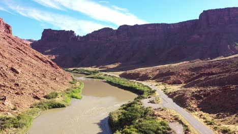 Slow-Aerial-flyover-of-the-Colorado-river-in-Utah-adjacent-to-highway-128-near-Moab-Utah-with-campsites