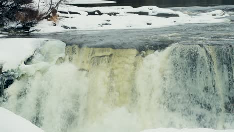 Close-Up-Slow-Motion-Panning-Shot-of-Environment-Nature-Tourism-Travel-Landmark-frozen-winter-Pisew-Kwasitchewan-Falls-Waterfall-Provincial-Park-near-Thompson-Manitoba-Northern-Arctic-Canada-Landscape