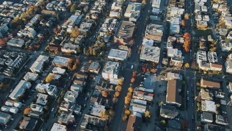 Aerial-high-angle-overview-of-urban-outskirts-city-buildings-and-homes-near-the-waterfront-of-Seattle