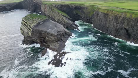 Aerial-view-of-the-dramatic-Kilkee-Cliffs-with-waves-crashing-along-the-Irish-coast