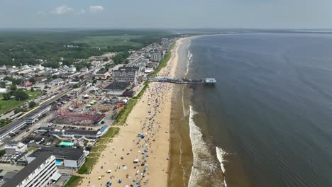 Aerial-shot-of-the-Old-Orchard-Beach-crowded-during-spring-break-in-Maine