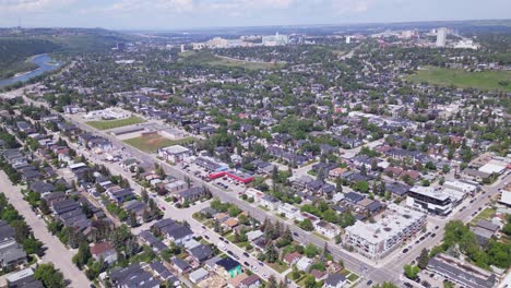 The-neighbourhoods-of-Hillhurst,-Upper-Hillhurst,-Kensington-and-Westmount-in-the-City-of-Calgary-are-flown-overhead-by-an-aerial-drone