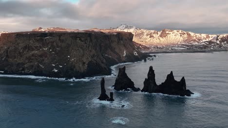 Reynisdrangar-Basalt-Sea-Stacks-In-South-Iceland---Aerial-Drone-Shot
