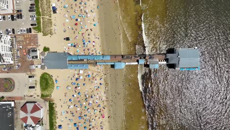 Overhead-drone-shot-of-the-Old-Orchard-Pier-on-Maine's-coast