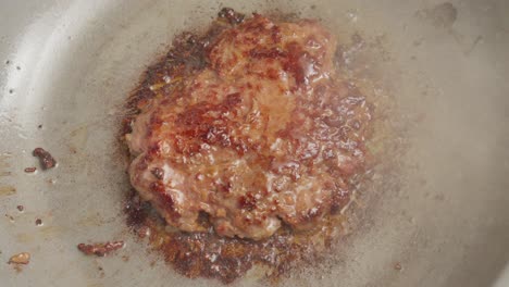 Beef-Patty,-seasoned-and-cooked-ground-mixture-formed-into-circular-shape